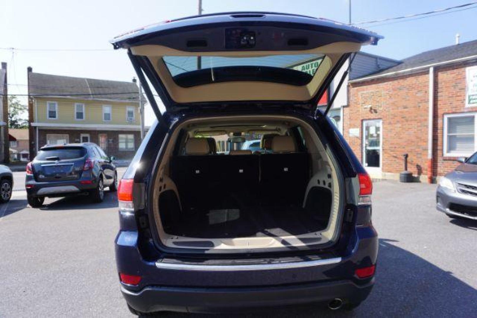 2015 True Blue Pearlcoat /Light Frost Beige/Black Jeep Grand Cherokee Limited 4WD (1C4RJFBG9FC) with an 3.6L V6 DOHC 24V engine, 8-Speed Automatic transmission, located at 312 Centre Ave, Schuylkill Haven, PA, 17972, (570) 593-5278, 40.638130, -76.177383 - adaptive cruise control, adv tech pkg, back up camera, blind spot monitor, collision avoidance system, heated front seats, lane departure warning, leather seats, navigation system, power liftgate, power sunroof, rear parking sensors, universal garage door opener - Photo#43