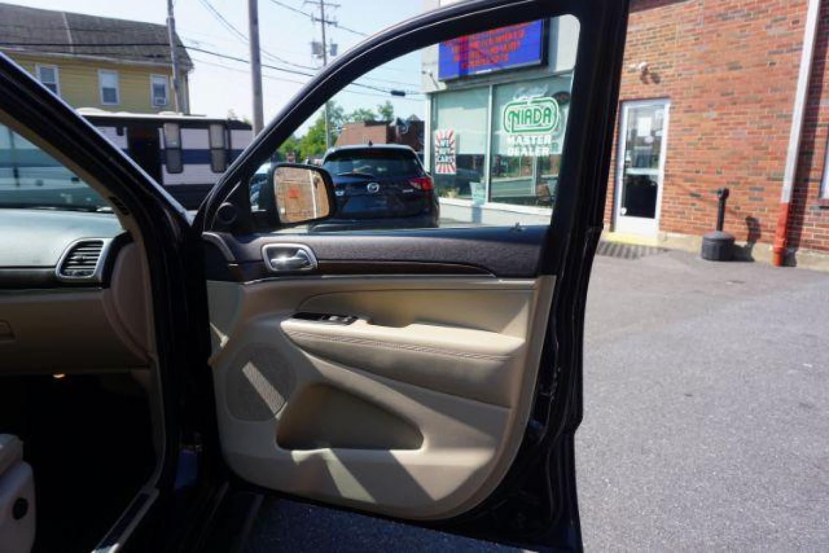 2015 True Blue Pearlcoat /Light Frost Beige/Black Jeep Grand Cherokee Limited 4WD (1C4RJFBG9FC) with an 3.6L V6 DOHC 24V engine, 8-Speed Automatic transmission, located at 312 Centre Ave, Schuylkill Haven, PA, 17972, (570) 593-5278, 40.638130, -76.177383 - adaptive cruise control, adv tech pkg, back up camera, blind spot monitor, collision avoidance system, heated front seats, lane departure warning, leather seats, navigation system, power liftgate, power sunroof, rear parking sensors, universal garage door opener - Photo#50