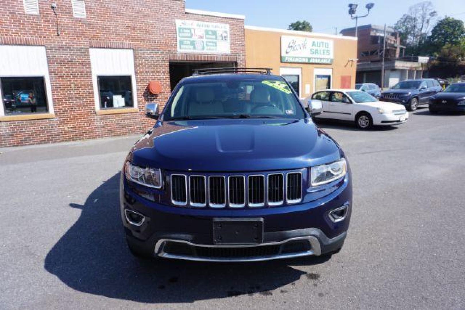 2015 True Blue Pearlcoat /Light Frost Beige/Black Jeep Grand Cherokee Limited 4WD (1C4RJFBG9FC) with an 3.6L V6 DOHC 24V engine, 8-Speed Automatic transmission, located at 312 Centre Ave, Schuylkill Haven, PA, 17972, (570) 593-5278, 40.638130, -76.177383 - adaptive cruise control, adv tech pkg, back up camera, blind spot monitor, collision avoidance system, heated front seats, lane departure warning, leather seats, navigation system, power liftgate, power sunroof, rear parking sensors, universal garage door opener - Photo#5