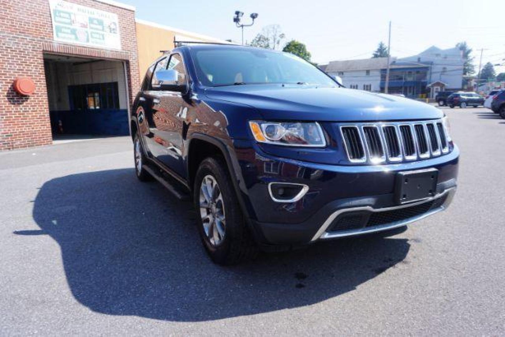 2015 True Blue Pearlcoat /Light Frost Beige/Black Jeep Grand Cherokee Limited 4WD (1C4RJFBG9FC) with an 3.6L V6 DOHC 24V engine, 8-Speed Automatic transmission, located at 312 Centre Ave, Schuylkill Haven, PA, 17972, (570) 593-5278, 40.638130, -76.177383 - adaptive cruise control, adv tech pkg, back up camera, blind spot monitor, collision avoidance system, heated front seats, lane departure warning, leather seats, navigation system, power liftgate, power sunroof, rear parking sensors, universal garage door opener - Photo#6