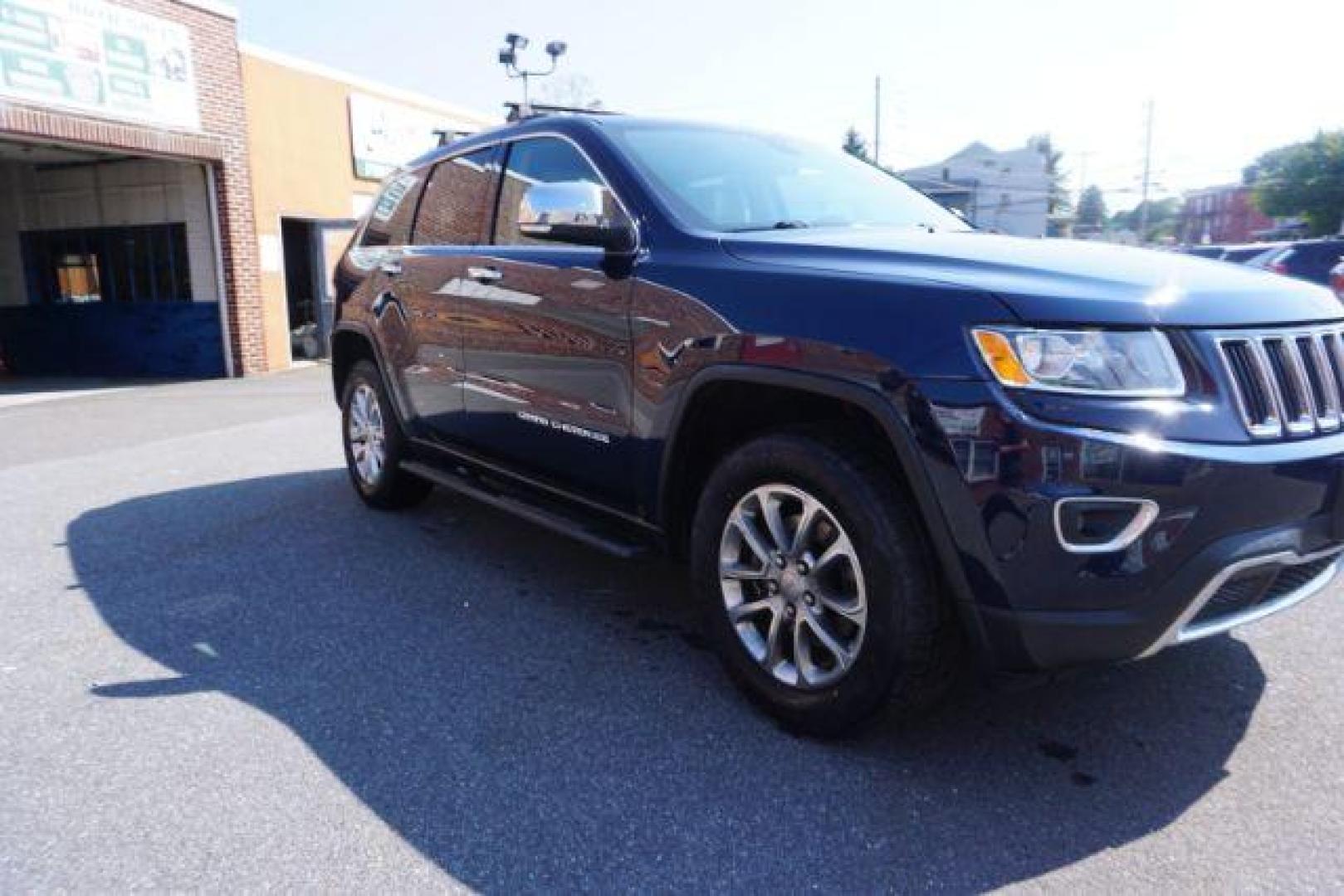 2015 True Blue Pearlcoat /Light Frost Beige/Black Jeep Grand Cherokee Limited 4WD (1C4RJFBG9FC) with an 3.6L V6 DOHC 24V engine, 8-Speed Automatic transmission, located at 312 Centre Ave, Schuylkill Haven, PA, 17972, (570) 593-5278, 40.638130, -76.177383 - adaptive cruise control, adv tech pkg, back up camera, blind spot monitor, collision avoidance system, heated front seats, lane departure warning, leather seats, navigation system, power liftgate, power sunroof, rear parking sensors, universal garage door opener - Photo#7