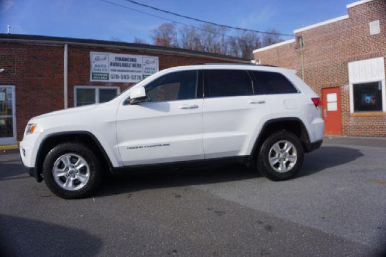 2016 Bright White Clear Coat /Black, cloth Jeep Grand Cherokee Laredo 4WD (1C4RJFAG1GC) with an 3.6L V6 DOHC 24V engine, 8-Speed Automatic transmission, located at 312 Centre Ave, Schuylkill Haven, PA, 17972, (570) 593-5278, 40.638130, -76.177383 - back up camera, locking/limited slip diff, luggage rack, luggage rack, rear parking sensors - Photo#0