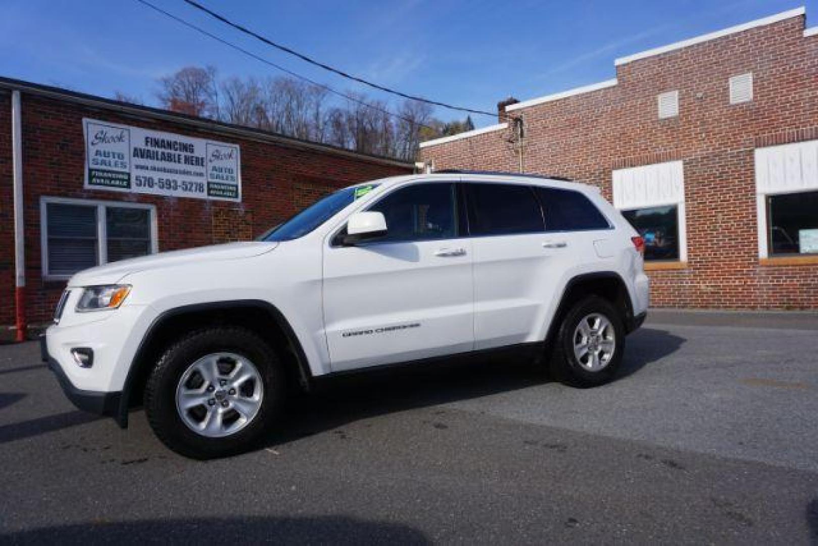 2016 Bright White Clear Coat /Black, cloth Jeep Grand Cherokee Laredo 4WD (1C4RJFAG1GC) with an 3.6L V6 DOHC 24V engine, 8-Speed Automatic transmission, located at 312 Centre Ave, Schuylkill Haven, PA, 17972, (570) 593-5278, 40.638130, -76.177383 - back up camera, locking/limited slip diff, luggage rack, luggage rack, rear parking sensors - Photo#1