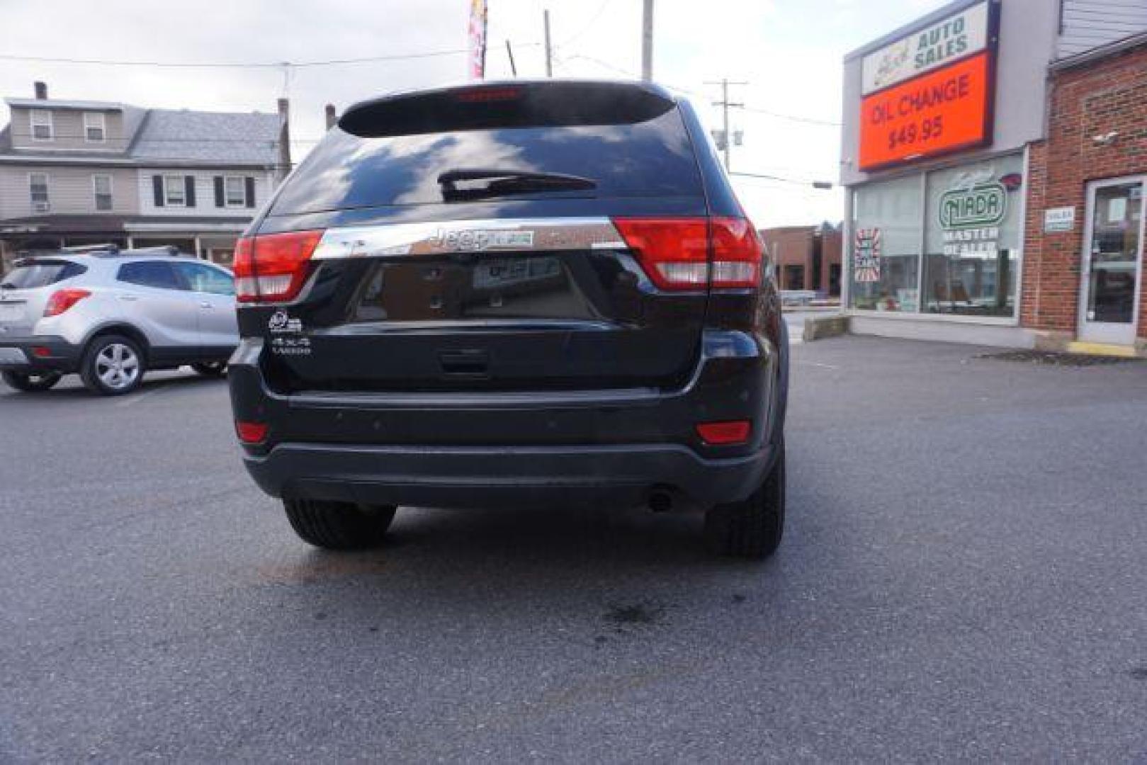 2012 Brilliant Black Crystal Pearl /Black Leather Interior Jeep Grand Cherokee Laredo 4WD (1C4RJFAGXCC) with an 3.6L V6 DOHC 24V engine, 5-Speed Automatic transmission, located at 312 Centre Ave, Schuylkill Haven, PA, 17972, (570) 593-5278, 40.638130, -76.177383 - automatic climate control, back up camera, heated front seats, leather seats, navigation, power liftgate, power sunroof, rear parking sensors - Photo#13