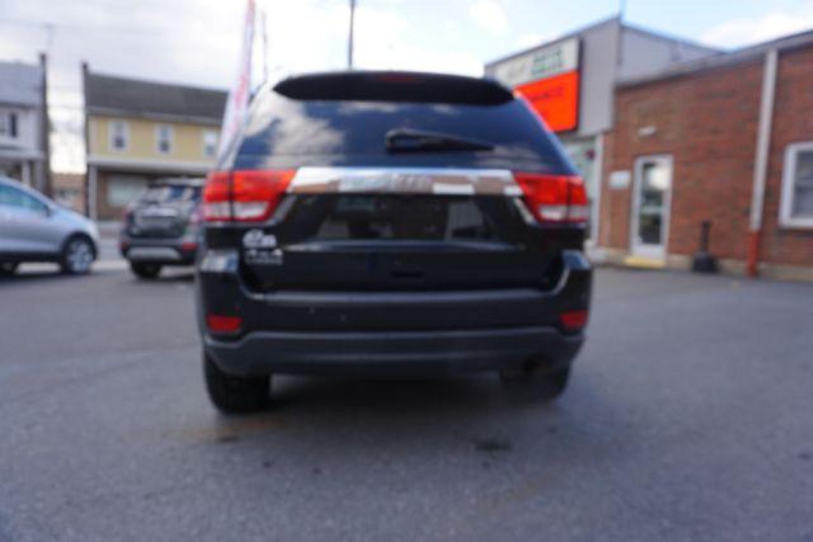 2012 Brilliant Black Crystal Pearl /Black Leather Interior Jeep Grand Cherokee Laredo 4WD (1C4RJFAGXCC) with an 3.6L V6 DOHC 24V engine, 5-Speed Automatic transmission, located at 312 Centre Ave, Schuylkill Haven, PA, 17972, (570) 593-5278, 40.638130, -76.177383 - automatic climate control, back up camera, heated front seats, leather seats, navigation, power liftgate, power sunroof, rear parking sensors - Photo#14