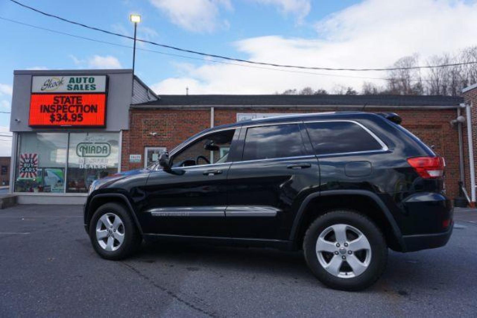 2012 Brilliant Black Crystal Pearl /Black Leather Interior Jeep Grand Cherokee Laredo 4WD (1C4RJFAGXCC) with an 3.6L V6 DOHC 24V engine, 5-Speed Automatic transmission, located at 312 Centre Ave, Schuylkill Haven, PA, 17972, (570) 593-5278, 40.638130, -76.177383 - automatic climate control, back up camera, heated front seats, leather seats, navigation, power liftgate, power sunroof, rear parking sensors - Photo#19