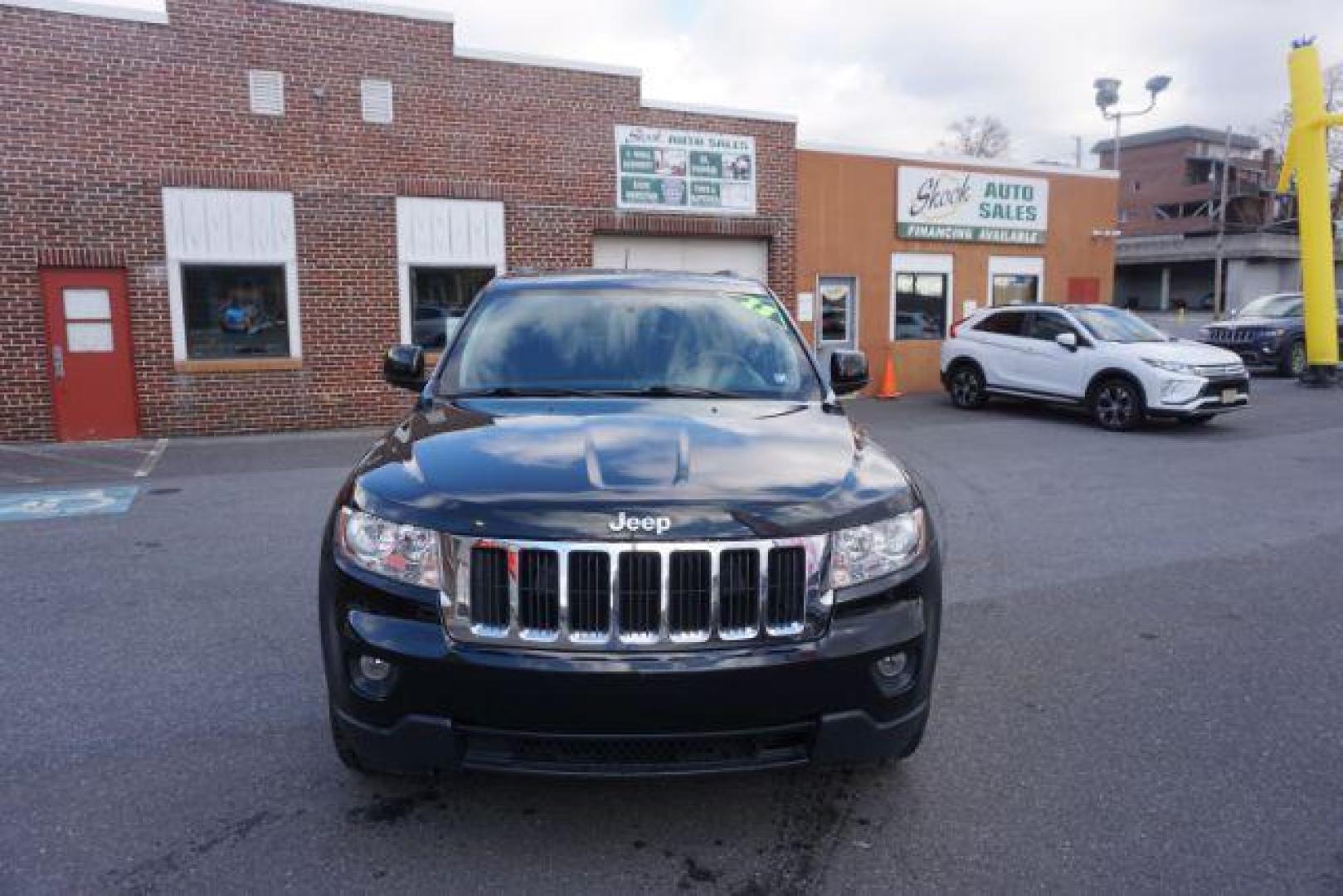 2012 Brilliant Black Crystal Pearl /Black Leather Interior Jeep Grand Cherokee Laredo 4WD (1C4RJFAGXCC) with an 3.6L V6 DOHC 24V engine, 5-Speed Automatic transmission, located at 312 Centre Ave, Schuylkill Haven, PA, 17972, (570) 593-5278, 40.638130, -76.177383 - automatic climate control, back up camera, heated front seats, leather seats, navigation, power liftgate, power sunroof, rear parking sensors - Photo#5