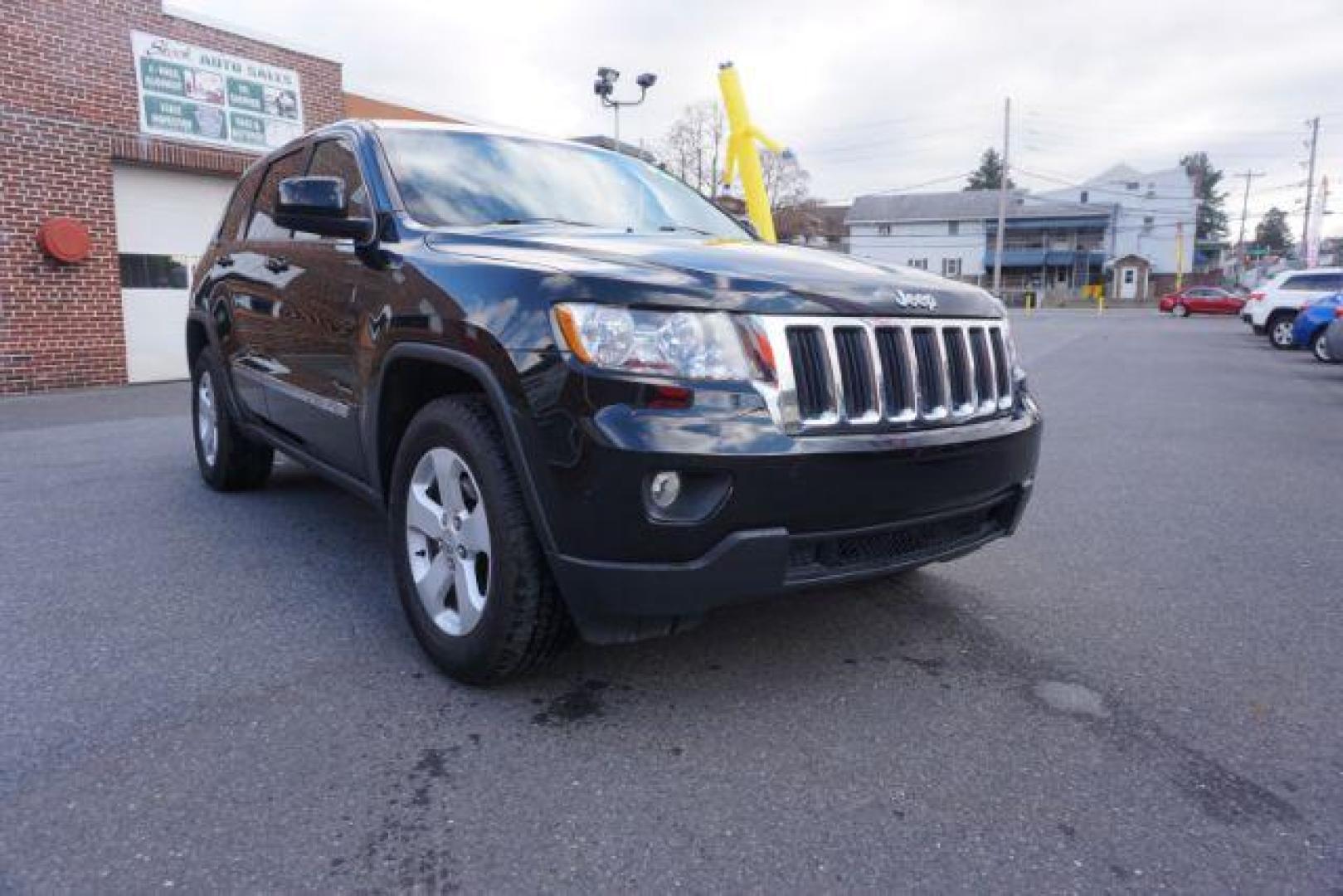 2012 Brilliant Black Crystal Pearl /Black Leather Interior Jeep Grand Cherokee Laredo 4WD (1C4RJFAGXCC) with an 3.6L V6 DOHC 24V engine, 5-Speed Automatic transmission, located at 312 Centre Ave, Schuylkill Haven, PA, 17972, (570) 593-5278, 40.638130, -76.177383 - automatic climate control, back up camera, heated front seats, leather seats, navigation, power liftgate, power sunroof, rear parking sensors - Photo#6