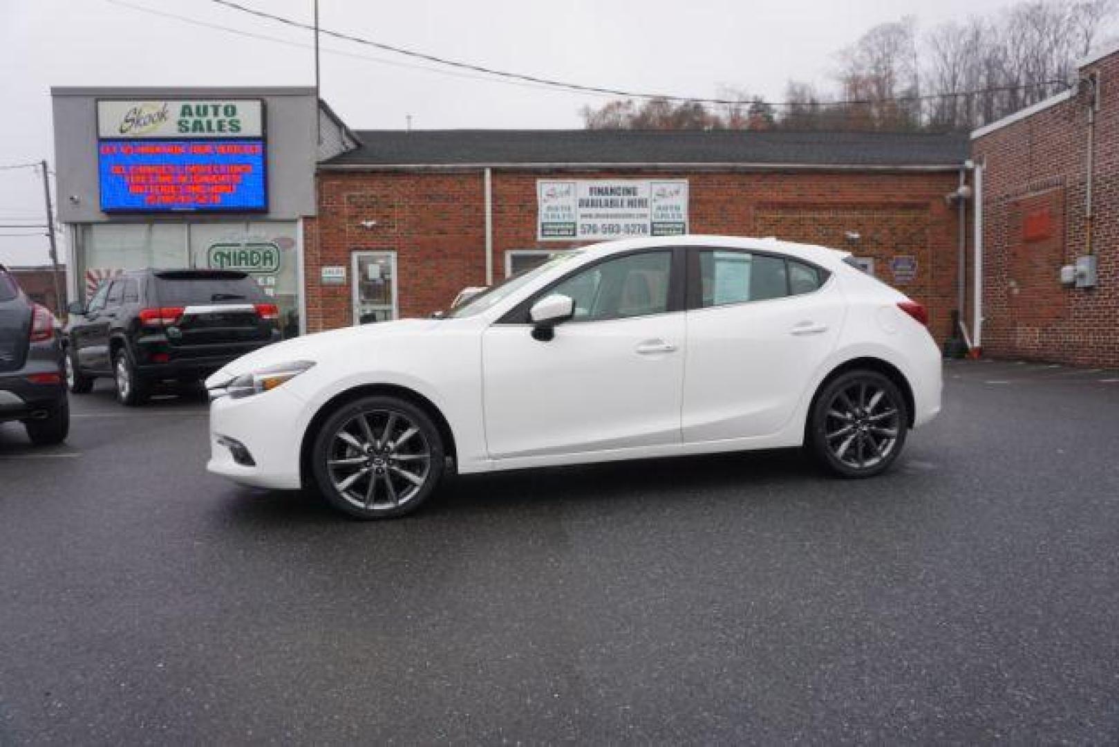 2018 Snowflake White Pearl Mica /beige Mazda MAZDA3 s Grand Touring AT 5-Door (3MZBN1M32JM) with an 2.5L L4 DOHC 16V engine, 6-Speed Automatic transmission, located at 312 Centre Ave, Schuylkill Haven, PA, 17972, (570) 593-5278, 40.638130, -76.177383 - adaptive cruise control, navigation system, rear parking sensors - Photo#0