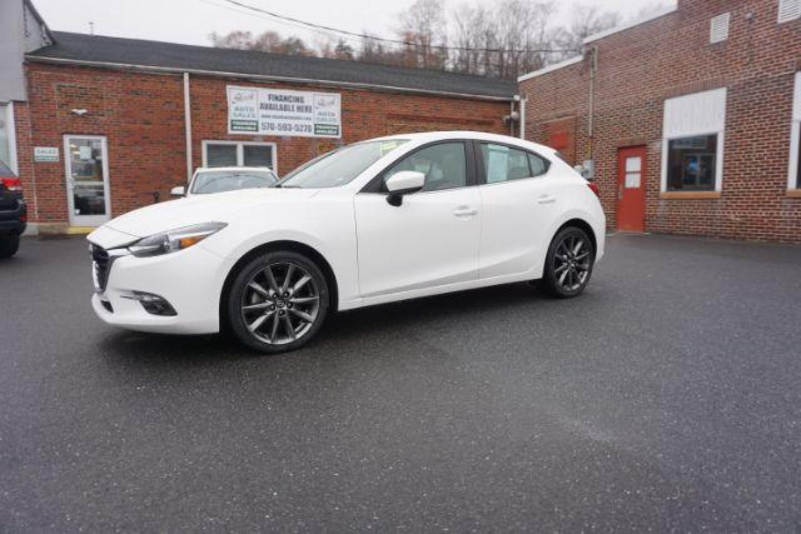 2018 Snowflake White Pearl Mica /beige Mazda MAZDA3 s Grand Touring AT 5-Door (3MZBN1M32JM) with an 2.5L L4 DOHC 16V engine, 6-Speed Automatic transmission, located at 312 Centre Ave, Schuylkill Haven, PA, 17972, (570) 593-5278, 40.638130, -76.177383 - adaptive cruise control, navigation system, rear parking sensors - Photo#1