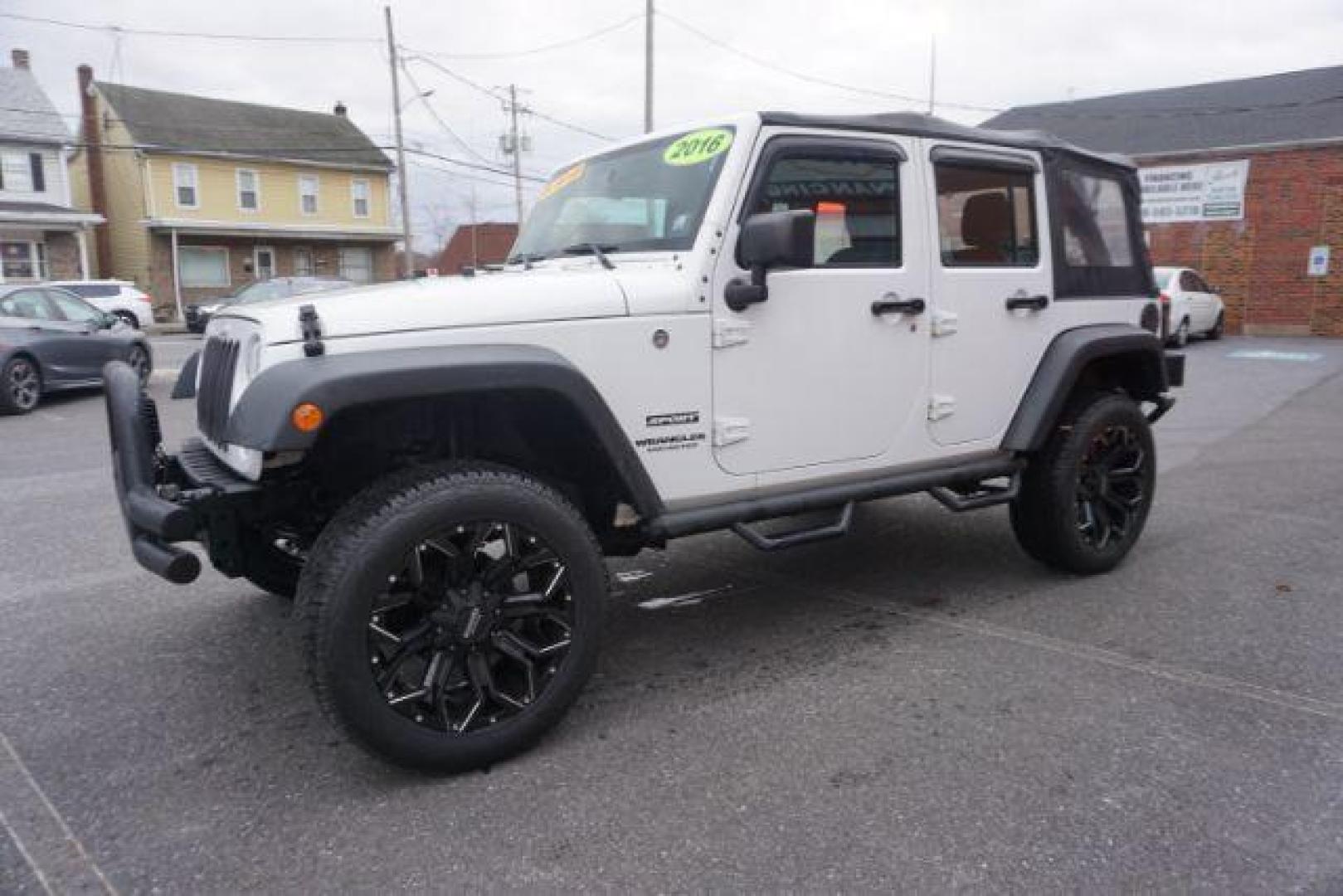 2016 Bright White Clear Coat /Black, cloth Jeep Wrangler Unlimited Sport 4WD (1C4BJWDG3GL) with an 3.6L V6 DOHC 24V FFV engine, located at 312 Centre Ave, Schuylkill Haven, PA, 17972, (570) 593-5278, 40.638130, -76.177383 - Photo#4