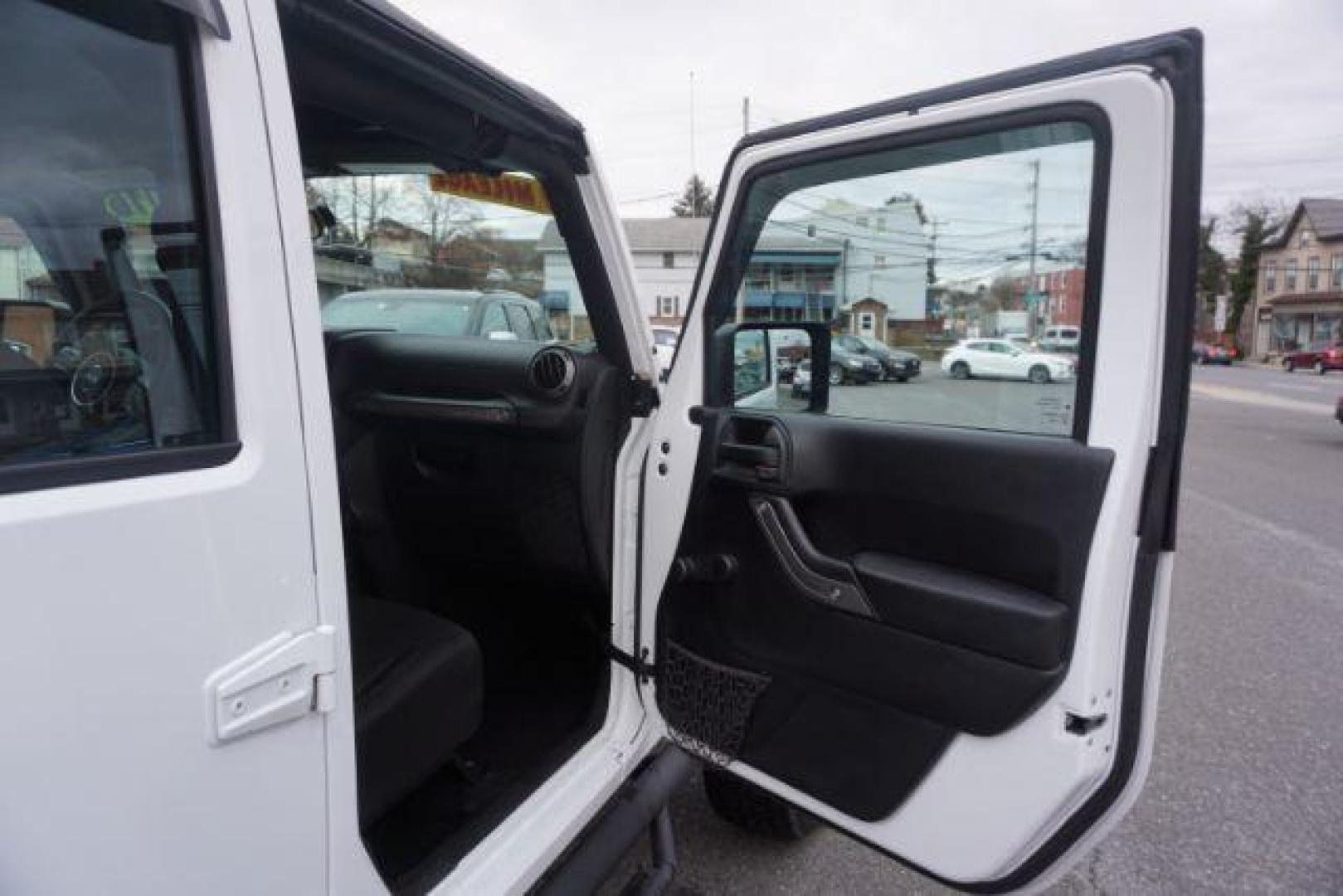 2016 Bright White Clear Coat /Black, cloth Jeep Wrangler Unlimited Sport 4WD (1C4BJWDG3GL) with an 3.6L V6 DOHC 24V FFV engine, located at 312 Centre Ave, Schuylkill Haven, PA, 17972, (570) 593-5278, 40.638130, -76.177383 - Photo#51