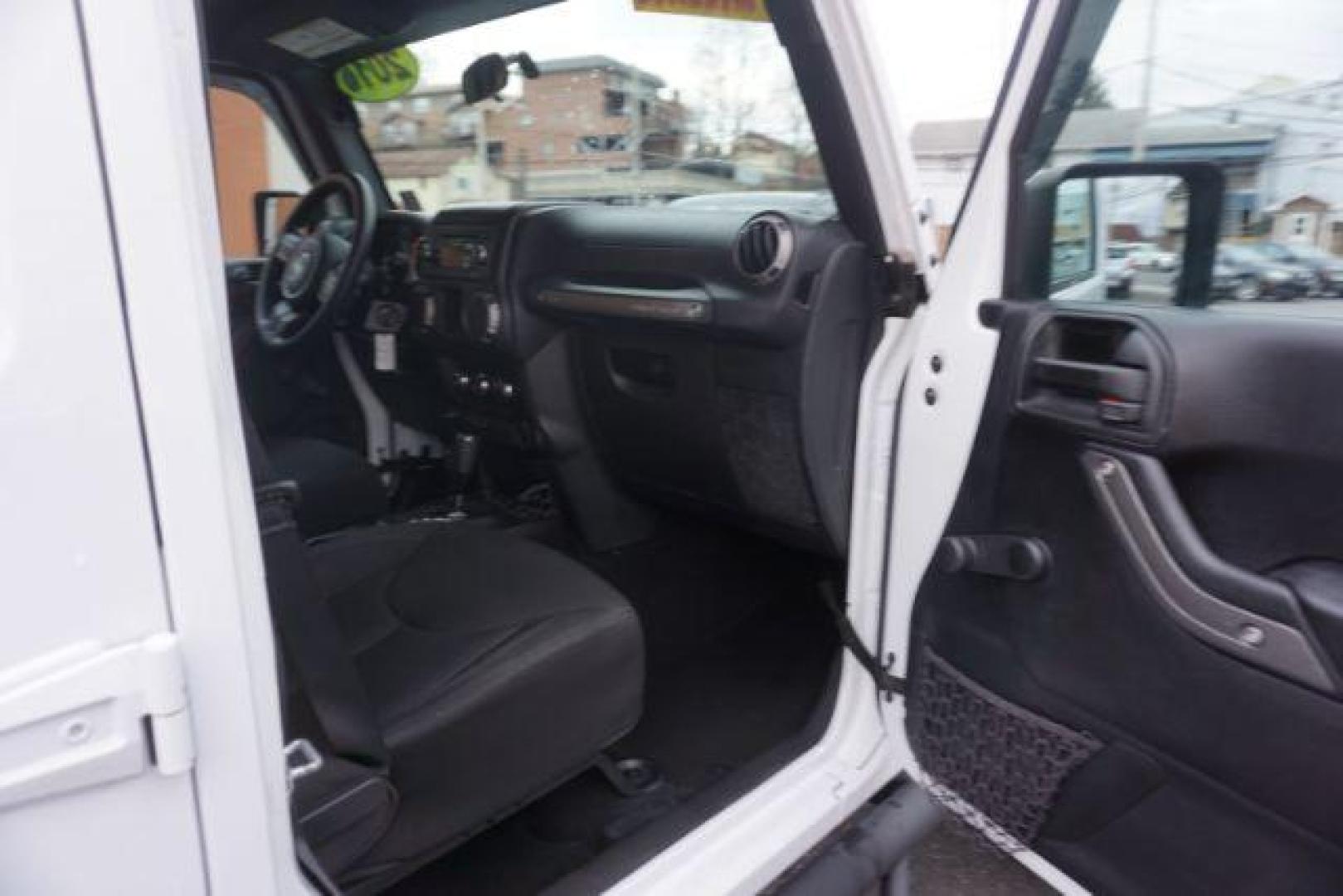 2016 Bright White Clear Coat /Black, cloth Jeep Wrangler Unlimited Sport 4WD (1C4BJWDG3GL) with an 3.6L V6 DOHC 24V FFV engine, located at 312 Centre Ave, Schuylkill Haven, PA, 17972, (570) 593-5278, 40.638130, -76.177383 - Photo#53