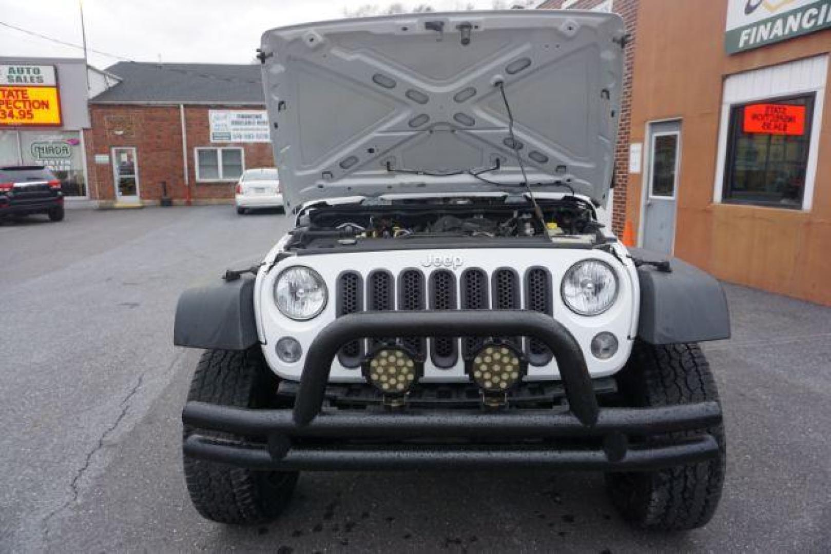 2016 Bright White Clear Coat /Black, cloth Jeep Wrangler Unlimited Sport 4WD (1C4BJWDG3GL) with an 3.6L V6 DOHC 24V FFV engine, located at 312 Centre Ave, Schuylkill Haven, PA, 17972, (570) 593-5278, 40.638130, -76.177383 - Photo#58