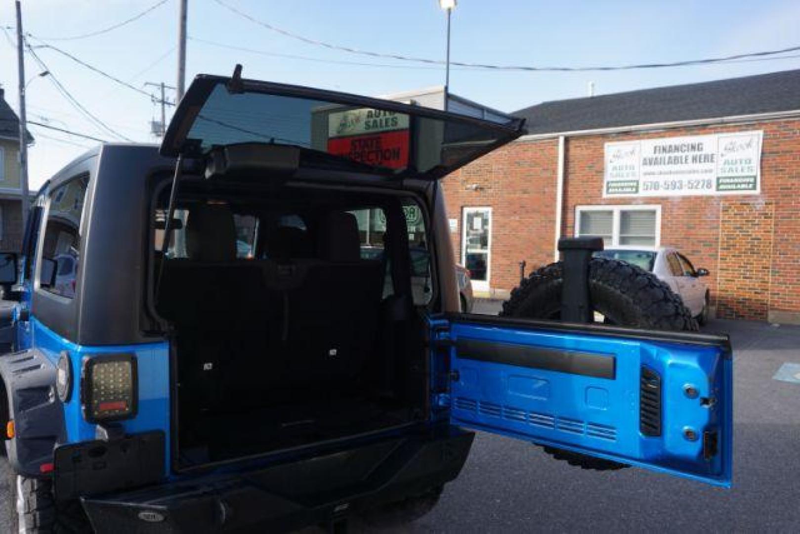 2015 Hydro Blue Pearl Coat /Black Jeep Wrangler Sport 4WD (1C4AJWAG2FL) with an 3.6L V6 DOHC 24V FFV engine, 5-Speed Automatic transmission, located at 312 Centre Ave, Schuylkill Haven, PA, 17972, (570) 593-5278, 40.638130, -76.177383 - bluetooth connection, hard top, locking/limited slip differential, navigation system, towing pkg - Photo#34