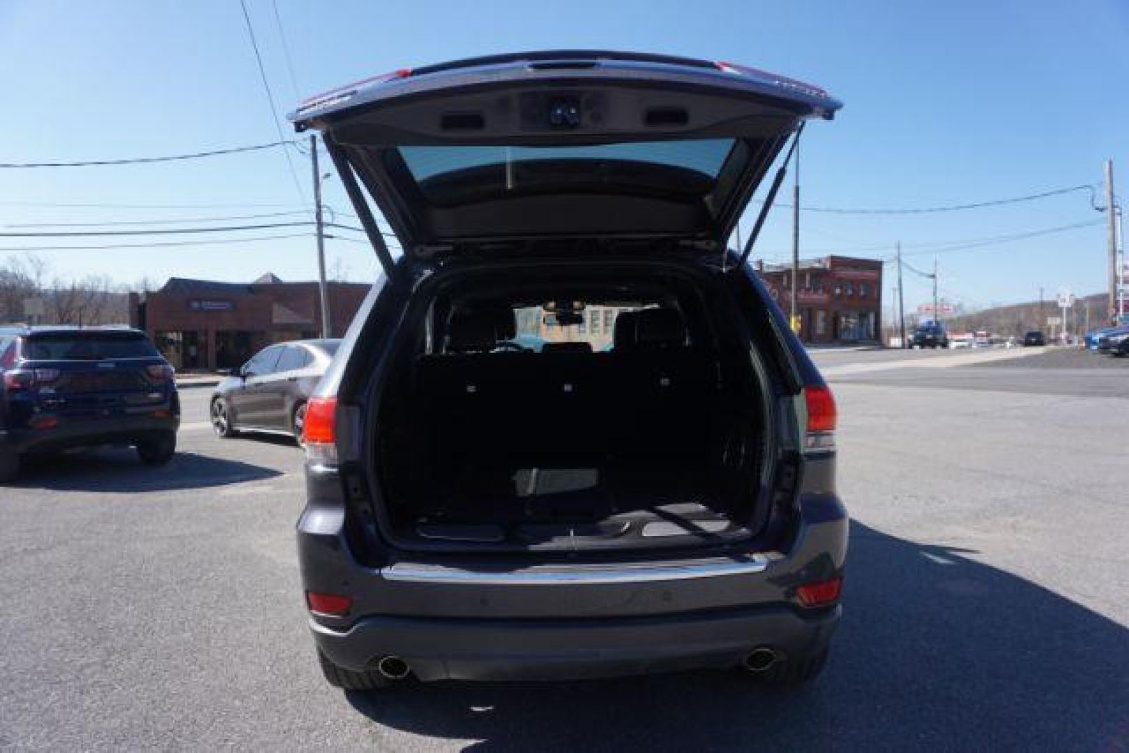 2014 Granite Crystal Metallic Clearcoat /Black Jeep Grand Cherokee Limited (1C4RJFBG9EC) with an 3.6L V-6 DOHC engine, located at 312 Centre Ave, Schuylkill Haven, PA, 17972, (570) 593-5278, 40.638130, -76.177383 - collision avoidance, HID headlamps, navigation, power liftgate, power sunroof, universal garage door opener - Photo#40