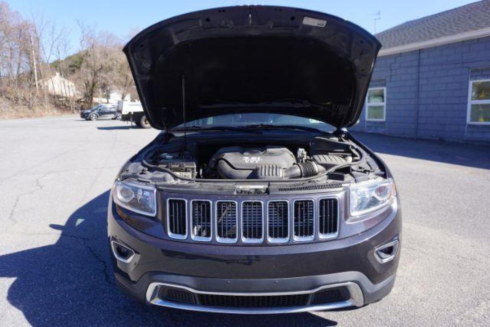 2014 Granite Crystal Metallic Clearcoat /Black Jeep Grand Cherokee Limited (1C4RJFBG9EC) with an 3.6L V-6 DOHC engine, located at 312 Centre Ave, Schuylkill Haven, PA, 17972, (570) 593-5278, 40.638130, -76.177383 - collision avoidance, HID headlamps, navigation, power liftgate, power sunroof, universal garage door opener - Photo#53