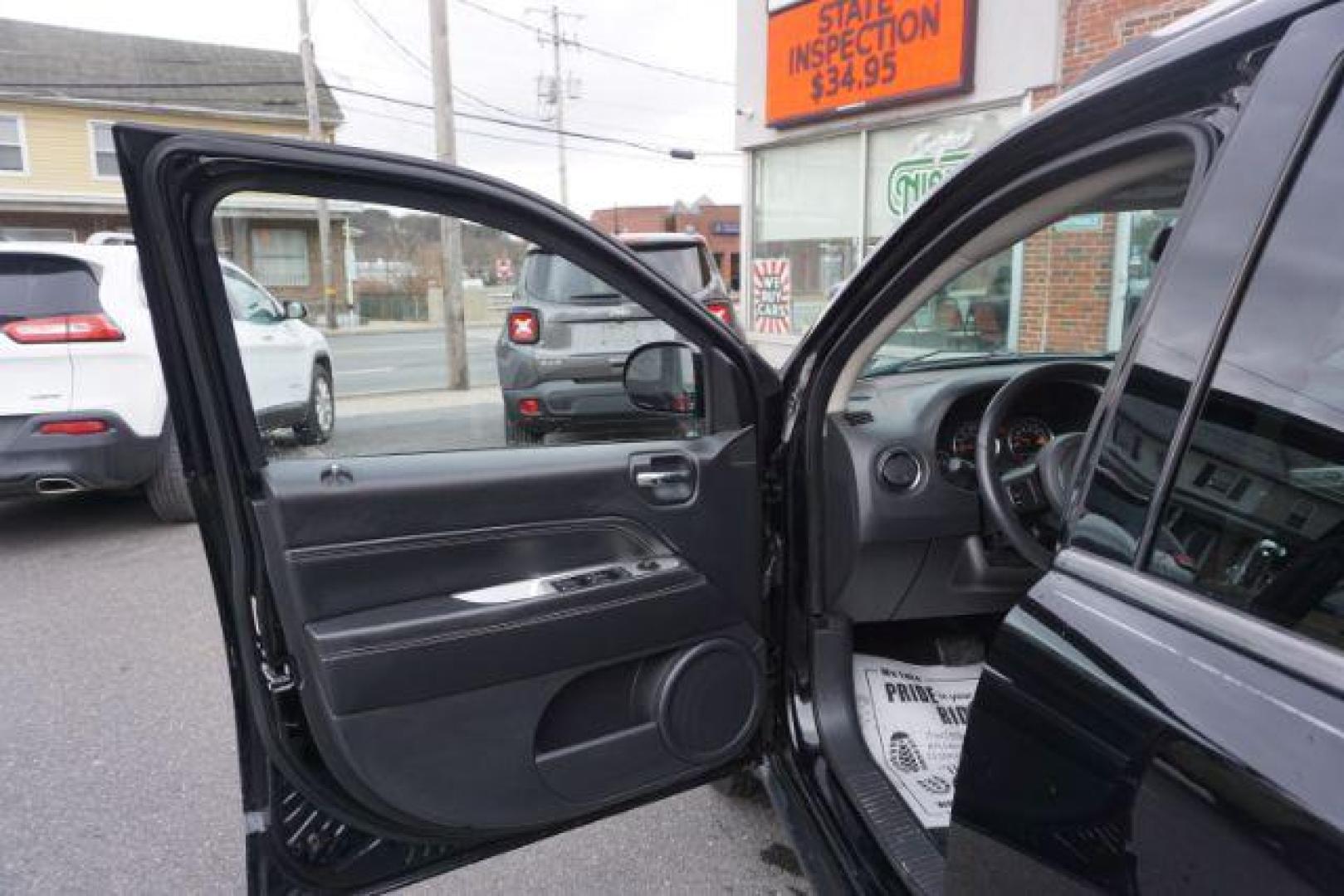 2014 Black Clearcoat /Dark Slate Gray Jeep Compass Latitude (1C4NJDEBXED) with an 2.4L I-4 DOHC engine, located at 312 Centre Ave, Schuylkill Haven, PA, 17972, (570) 593-5278, 40.638130, -76.177383 - bluetooth, locking/limited slip differential - Photo#16