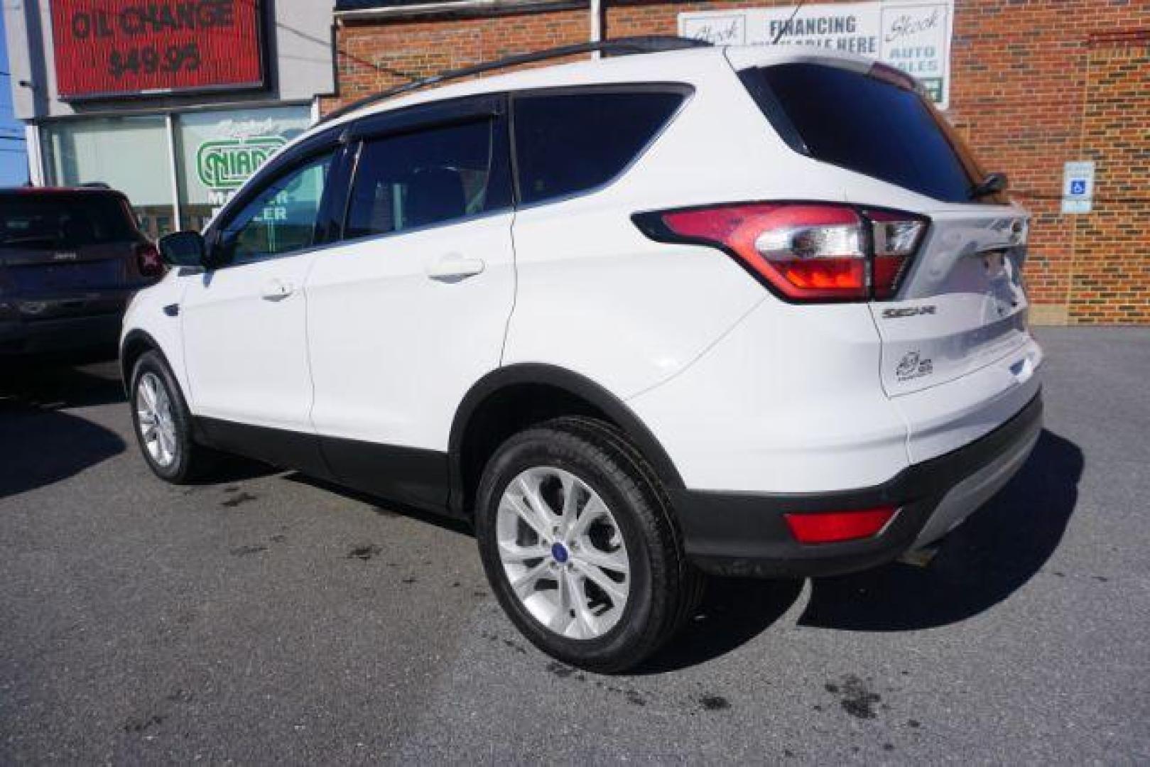 2017 Oxford White /Charcoal Black Ford Escape SE (1FMCU9GDXHU) with an EcoBoost 1.5L I-4 gasoline direct injection engine, located at 312 Centre Ave, Schuylkill Haven, PA, 17972, (570) 593-5278, 40.638130, -76.177383 - blind spot monitor, heated exterior mirrors, heated front seats, leather seats, luggage rack, navigation, power passenger seat, power sunroof, rear parking sensors - Photo#11