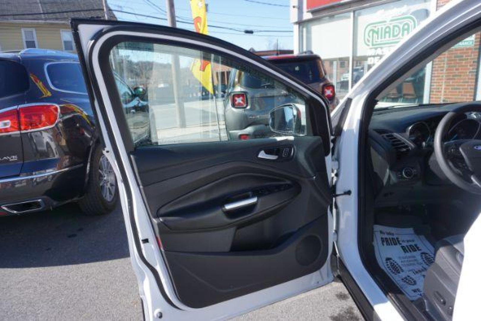 2017 Oxford White /Charcoal Black Ford Escape SE (1FMCU9GDXHU) with an EcoBoost 1.5L I-4 gasoline direct injection engine, located at 312 Centre Ave, Schuylkill Haven, PA, 17972, (570) 593-5278, 40.638130, -76.177383 - blind spot monitor, heated exterior mirrors, heated front seats, leather seats, luggage rack, navigation, power passenger seat, power sunroof, rear parking sensors - Photo#16