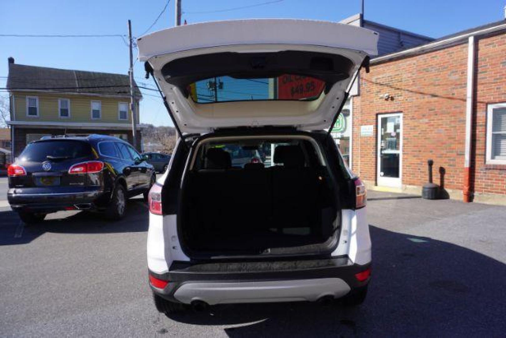 2017 Oxford White /Charcoal Black Ford Escape SE (1FMCU9GDXHU) with an EcoBoost 1.5L I-4 gasoline direct injection engine, located at 312 Centre Ave, Schuylkill Haven, PA, 17972, (570) 593-5278, 40.638130, -76.177383 - blind spot monitor, heated exterior mirrors, heated front seats, leather seats, luggage rack, navigation, power passenger seat, power sunroof, rear parking sensors - Photo#39