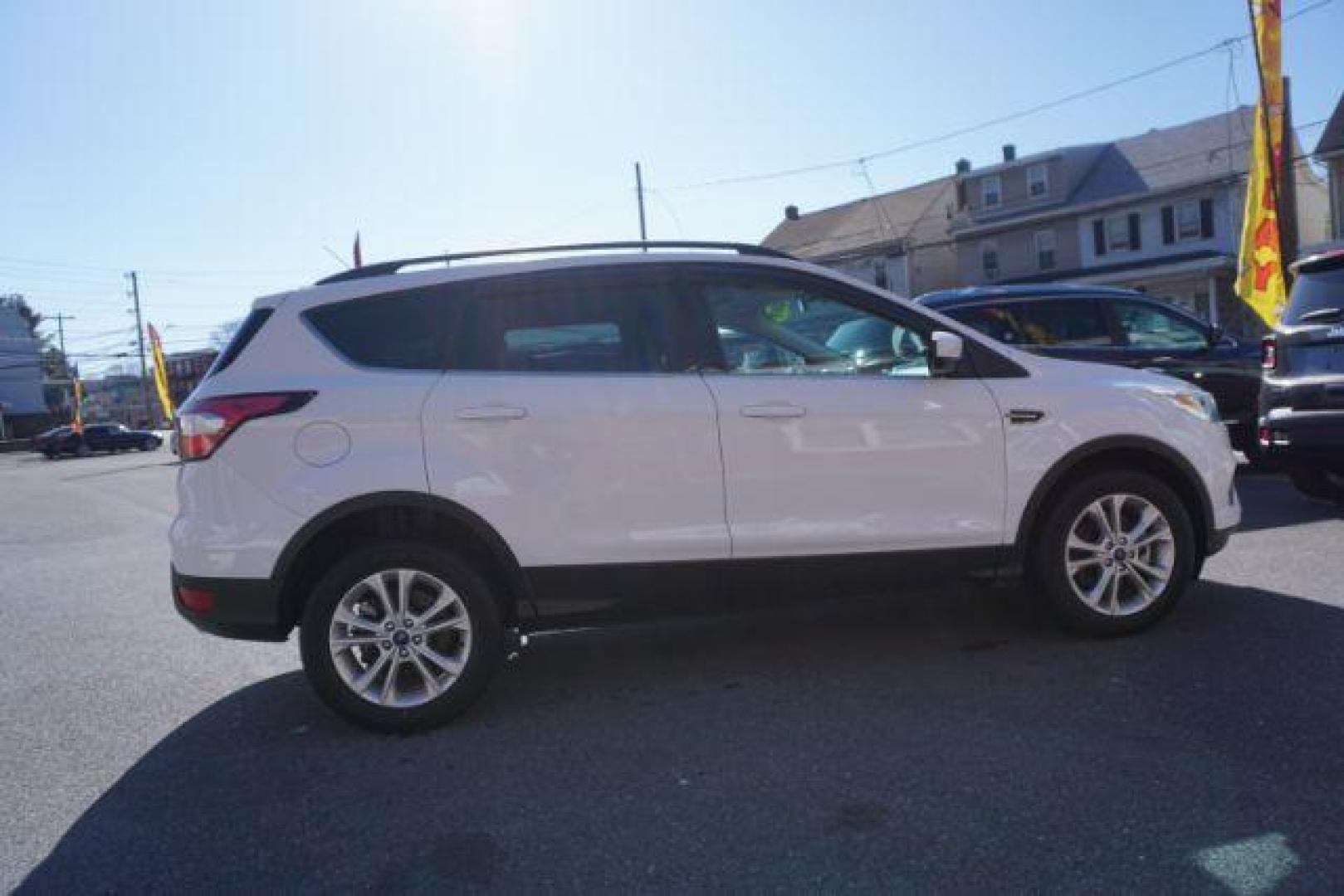 2017 Oxford White /Charcoal Black Ford Escape SE (1FMCU9GDXHU) with an EcoBoost 1.5L I-4 gasoline direct injection engine, located at 312 Centre Ave, Schuylkill Haven, PA, 17972, (570) 593-5278, 40.638130, -76.177383 - blind spot monitor, heated exterior mirrors, heated front seats, leather seats, luggage rack, navigation, power passenger seat, power sunroof, rear parking sensors - Photo#7