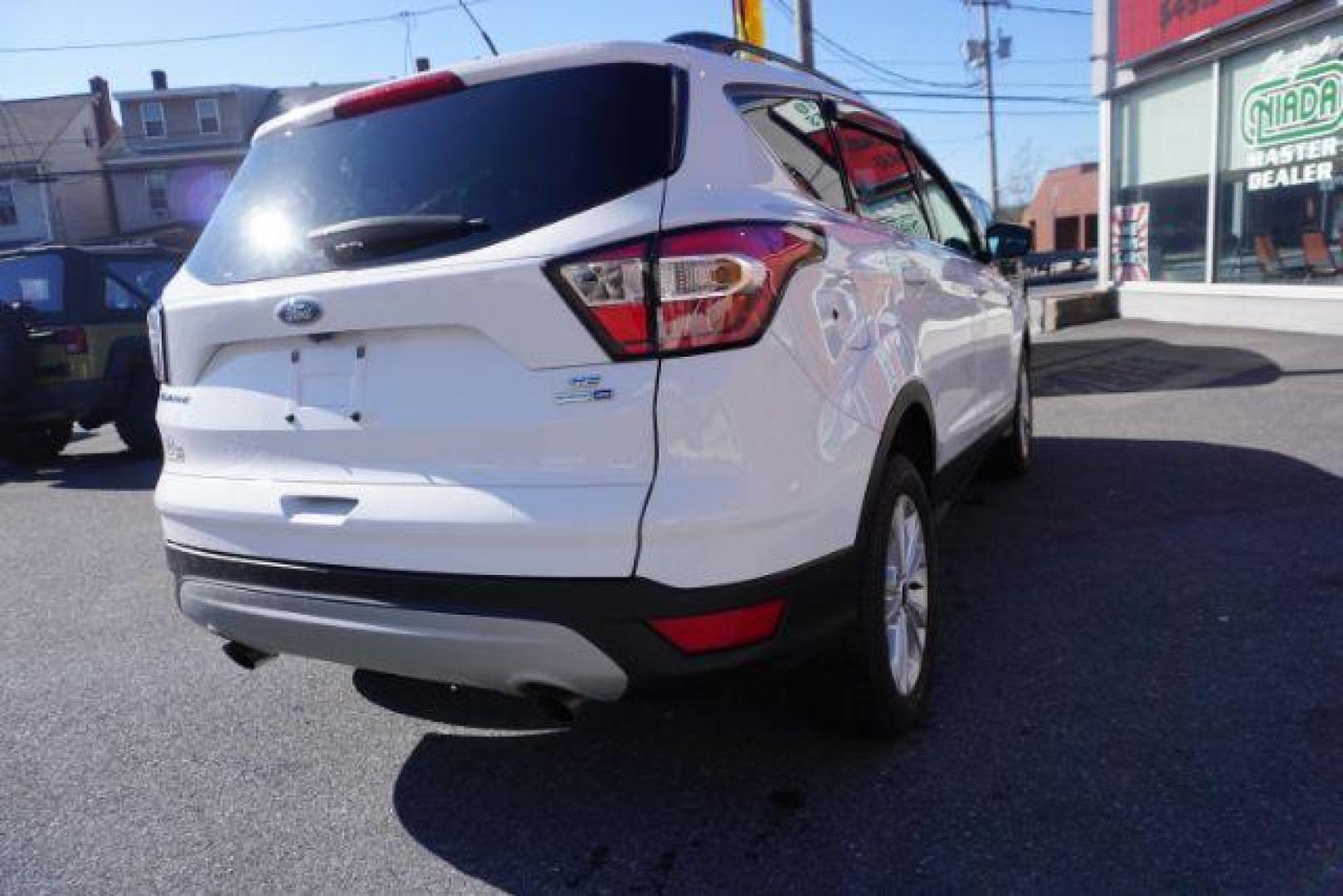 2017 Oxford White /Charcoal Black Ford Escape SE (1FMCU9GDXHU) with an EcoBoost 1.5L I-4 gasoline direct injection engine, located at 312 Centre Ave, Schuylkill Haven, PA, 17972, (570) 593-5278, 40.638130, -76.177383 - blind spot monitor, heated exterior mirrors, heated front seats, leather seats, luggage rack, navigation, power passenger seat, power sunroof, rear parking sensors - Photo#8